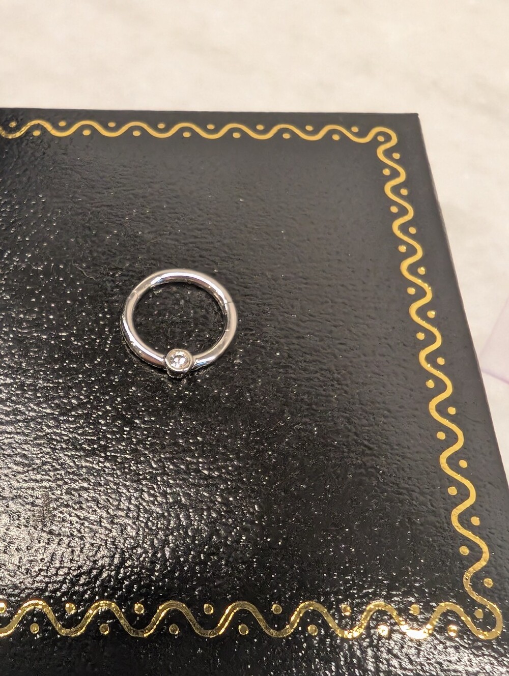 14k White Gold 16 Gauge Seamless Hoop With Side Diamond - Picture 3 of 4